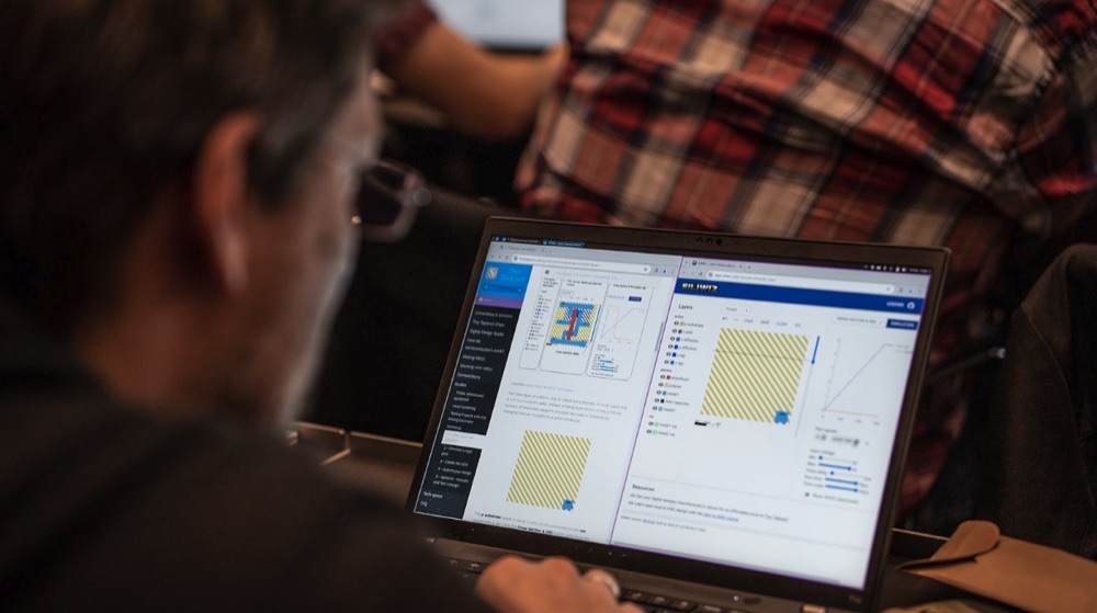 A workshop attendee with the SiliWiz semiconductor tool open on their laptop